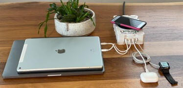 The GridMover Charger on wall power charging laptop + other devices