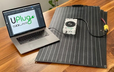 The GridMover Charger on Solar charging a laptop