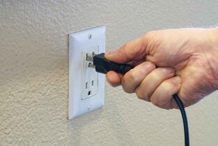 The GridMover Charger plugging into wall power